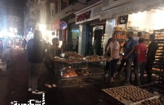 حي وسط.... حملة لرفع اشغالات محل حلويات ومخبوزات بشارع لاجتيه بالابراهيمة